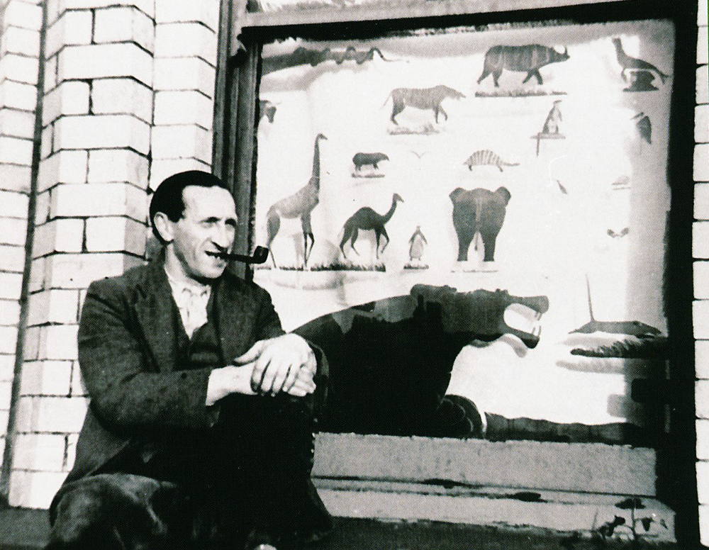 Mr Neunzer, known as “Blick” with his Animal Window, In Hutchinson Square Camp, Douglas, Isle of Man, c.1940.