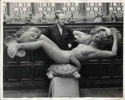 23. Fleischmann posing with plaster model of Miranda in his London studio